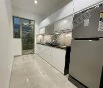 runwal meadows kitchen design having double door fridge