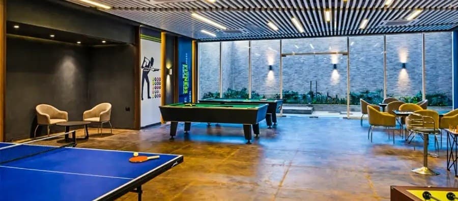 Indoor games room with pool table and modern lighting