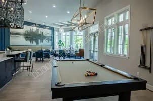 Indoor games room with pool table