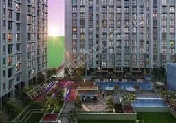 Exterior view of high-rise apartment buildings with poolside amenities