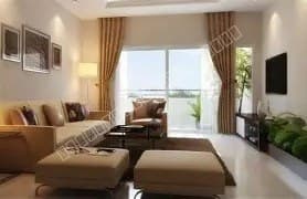 Modern living room with comfortable seating and balcony access