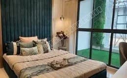 Luxury bedroom with plush bedding and garden window view